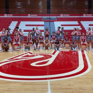 JHS girls basketball team posing for a team picture